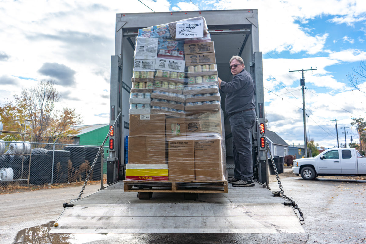 Montana Food Bank Network  Delivery Driver, Doug Topp, unloads one of two pallets from the truck into the Haven House Food Bank located in Hamilton, Montana.
